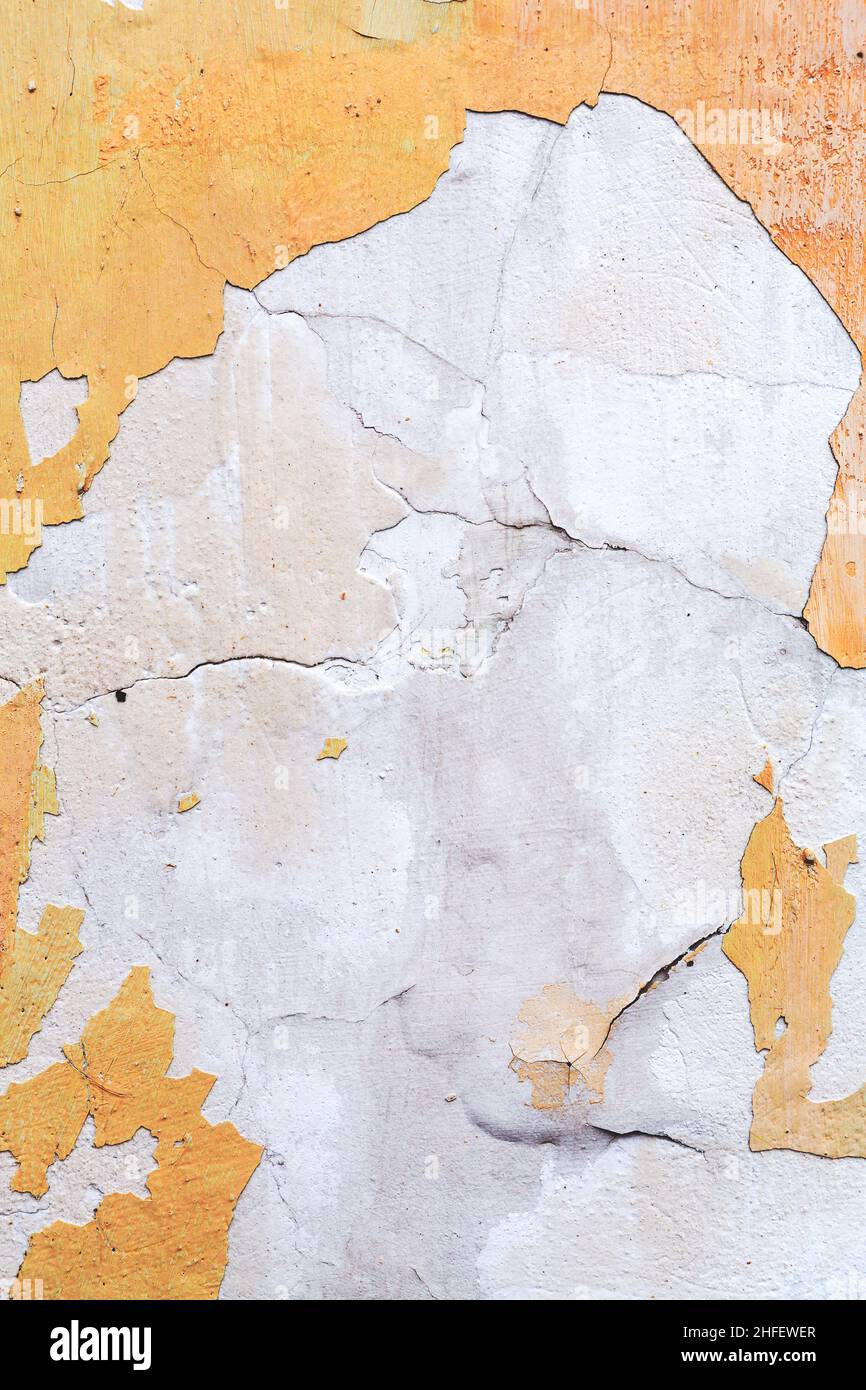 Concrete, weathered, worn, damaged wall paint. Rough, concrete surface