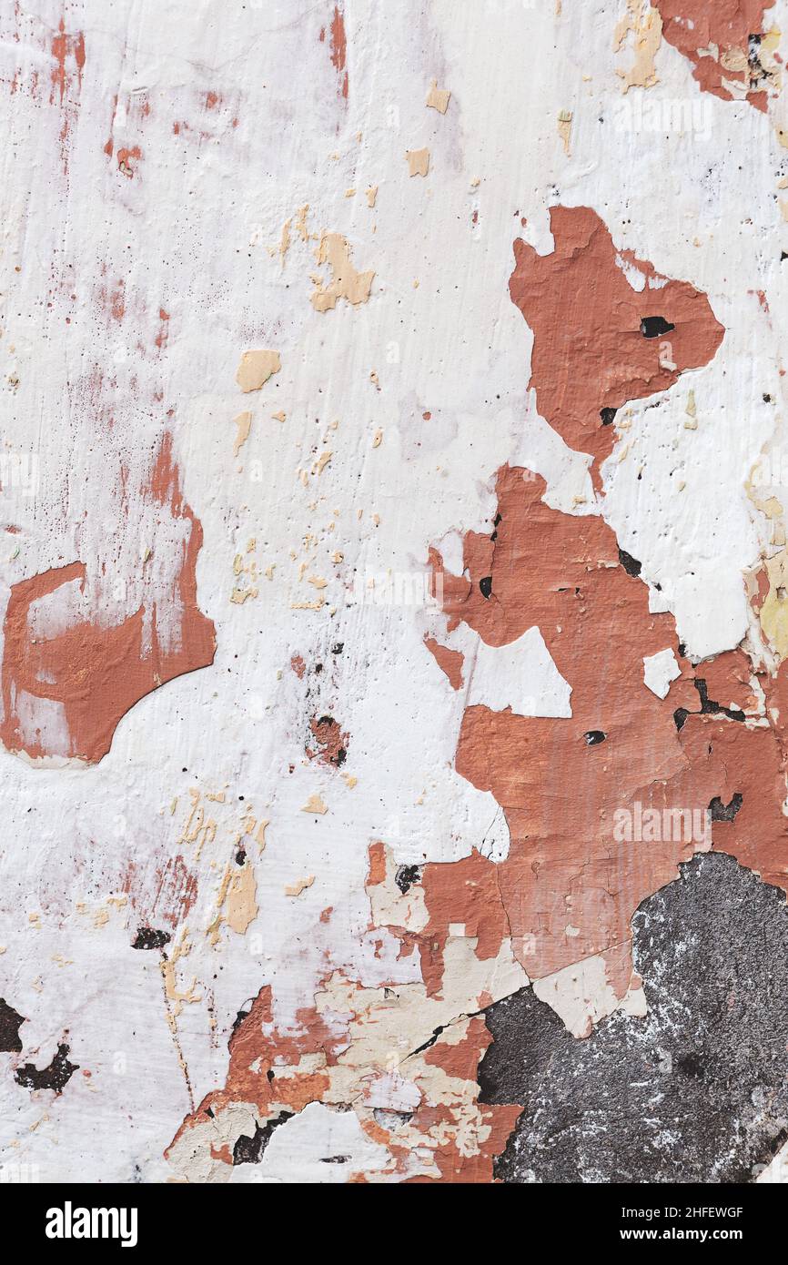 Concrete, weathered, worn, damaged wall paint. Rough, concrete surface