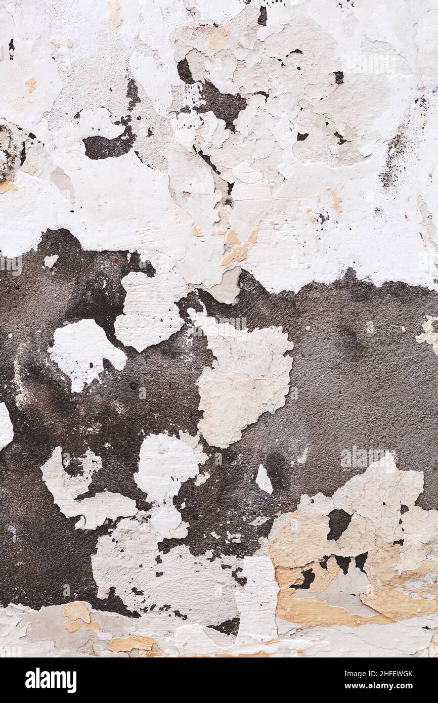Concrete, weathered, worn, damaged wall paint. Rough, concrete surface