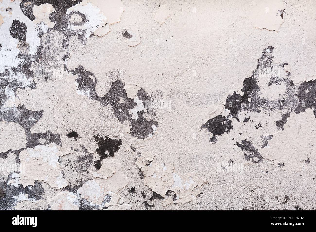 Concrete, weathered, worn, damaged wall paint. Rough, concrete surface