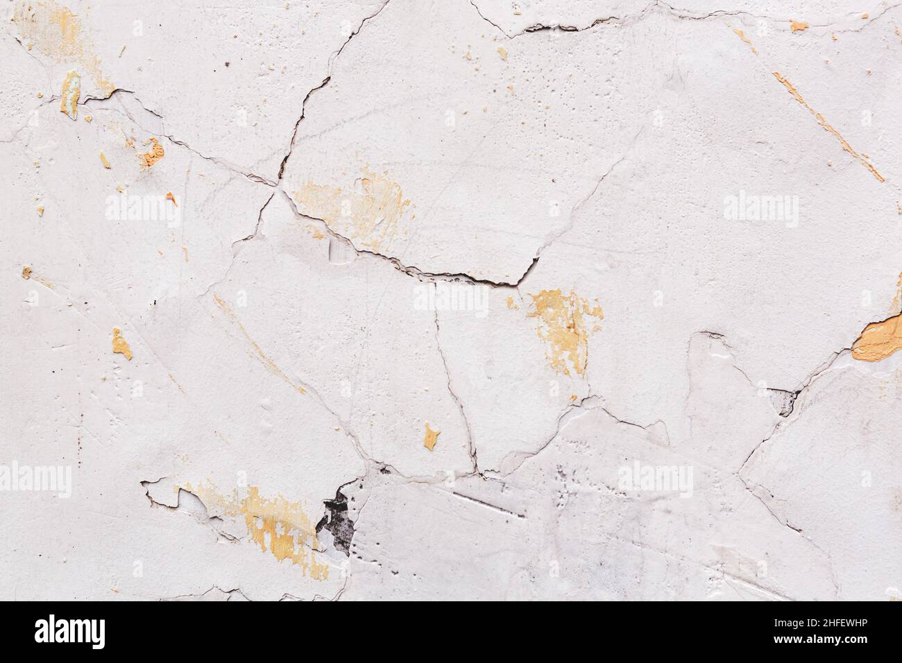 Concrete, weathered, worn, damaged wall paint. Rough, concrete surface