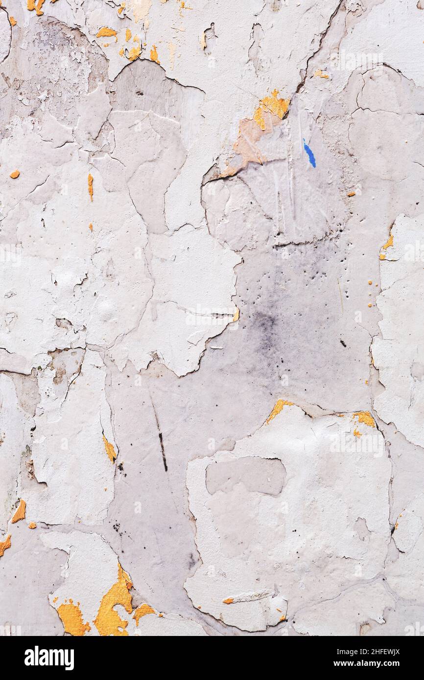Concrete, weathered, worn, damaged wall paint. Rough, concrete surface
