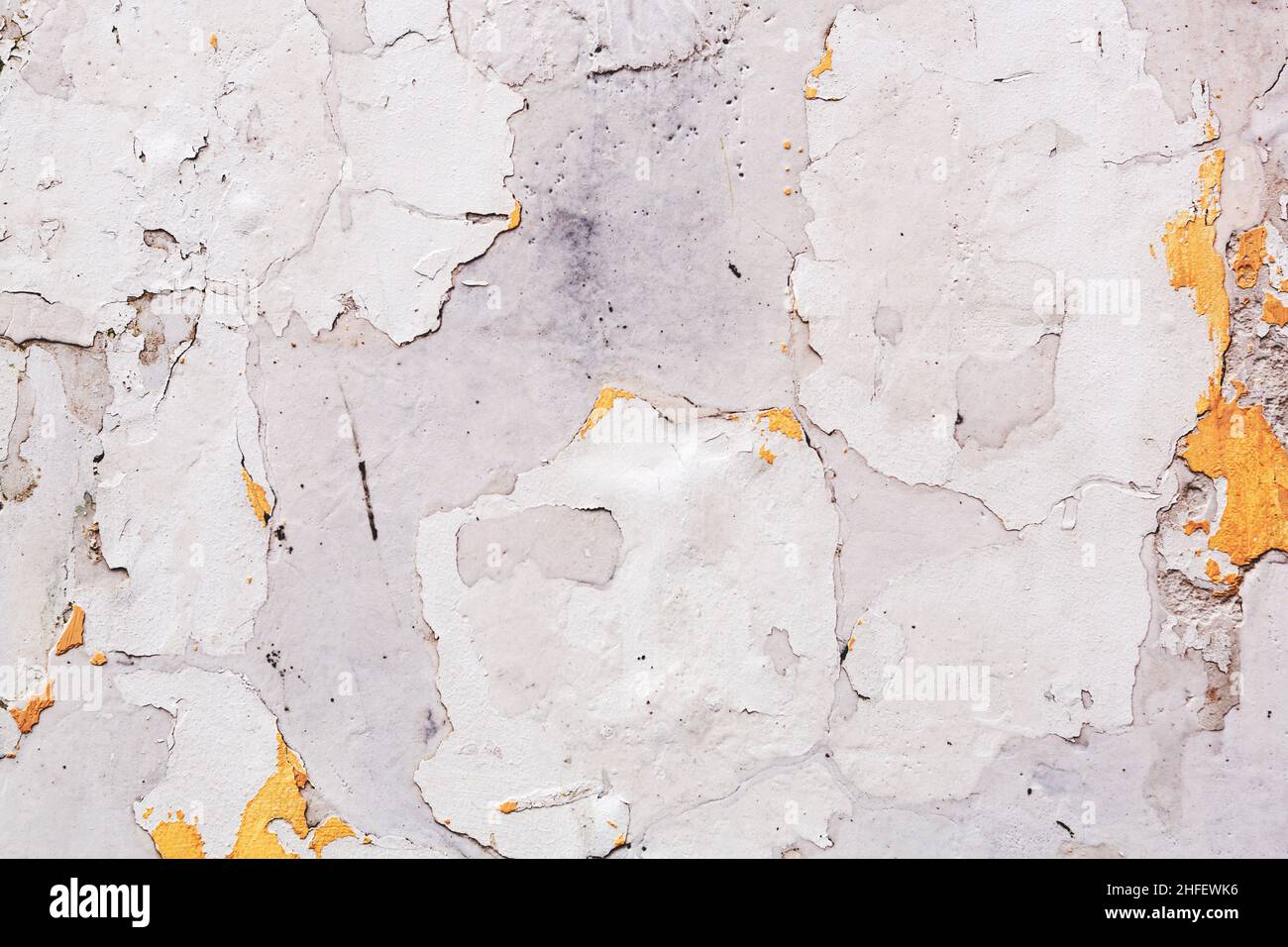Concrete, weathered, worn, damaged wall paint. Rough, concrete surface