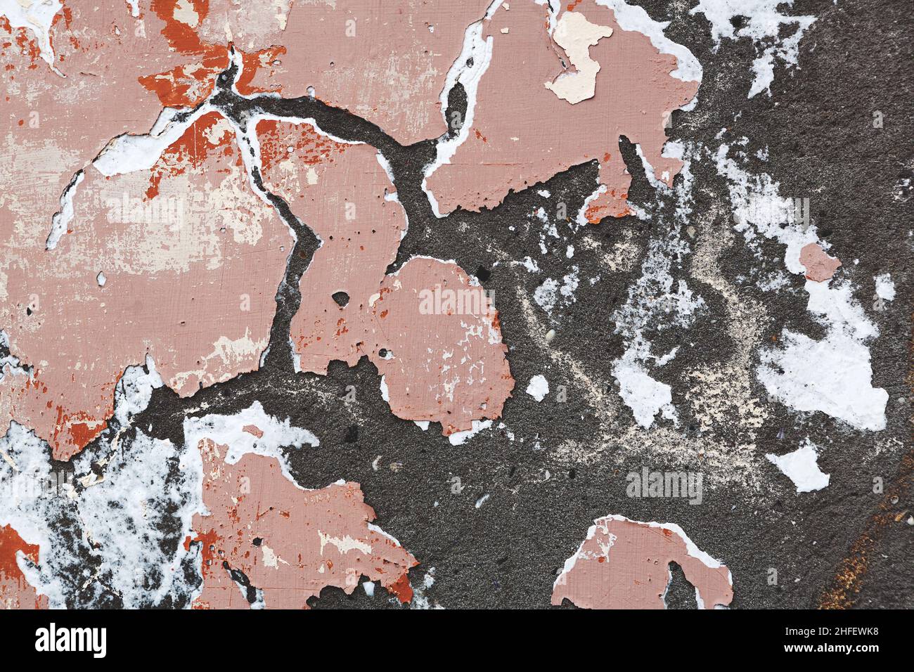 Concrete, weathered, worn, damaged wall paint. Rough, concrete surface