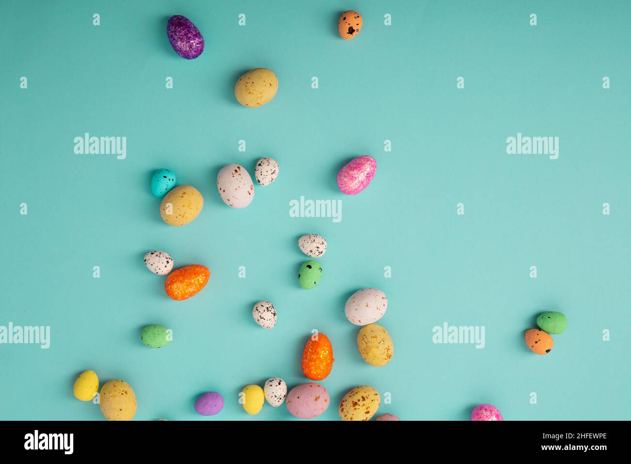 Easter color background with eggs candy and decor Stock Photo