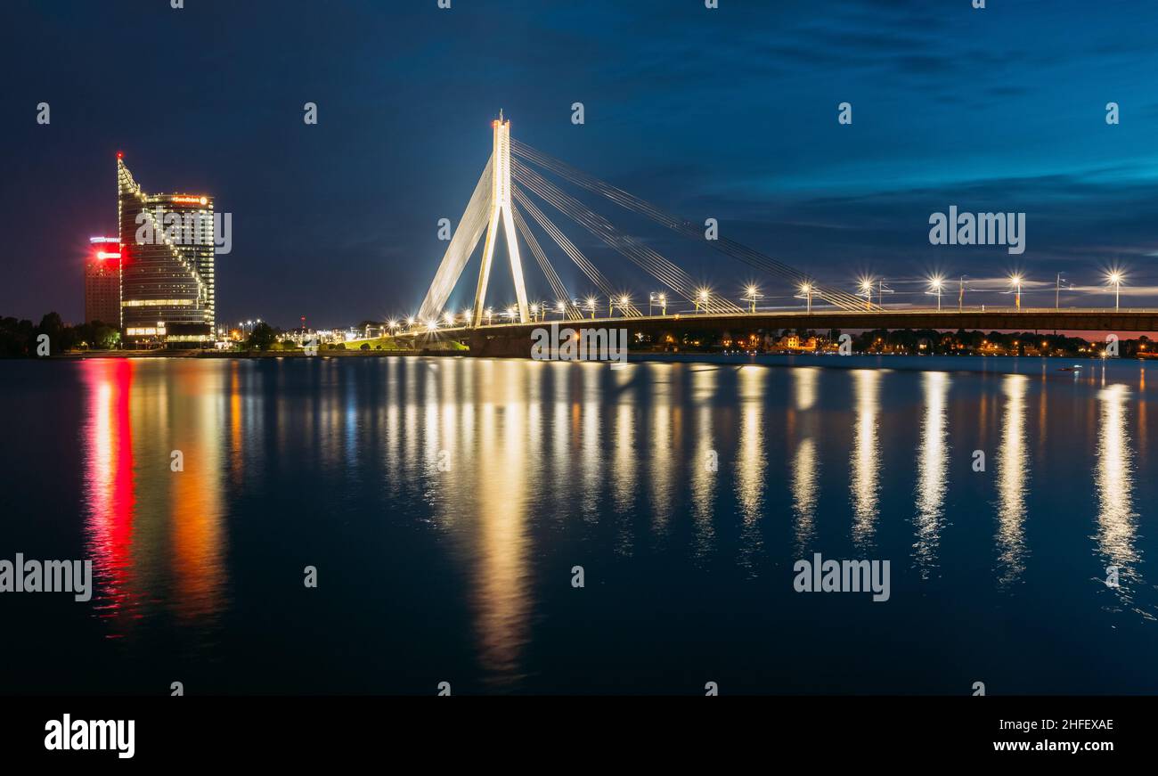 Riga Latvia. Scenic View Of Vansu Cable-Stayed Bridge In Evening Illumination Over Daugava River Stock Photo