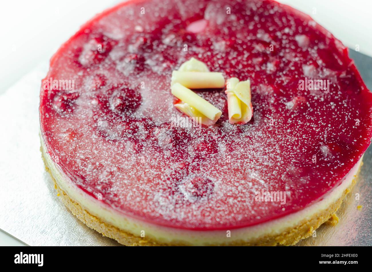 Digestive biscuits base with white chocolate cheesecake, Heritage raspberries and raspberry