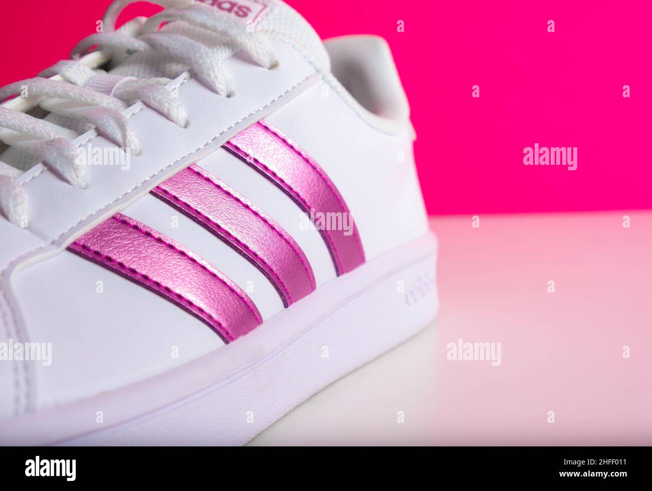 Badajoz, Spain, 01, 16,2022. adidas pink sneakers shoes with shoelace side  view on floor soft focus with copy space Stock Photo - Alamy
