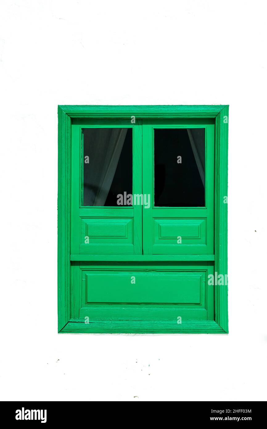 typical green window with white wall in Lanzarote Stock Photo