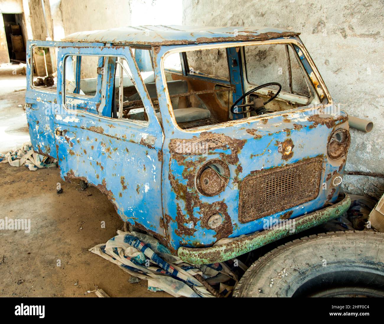 old  rotten car in abandoned factory Stock Photo