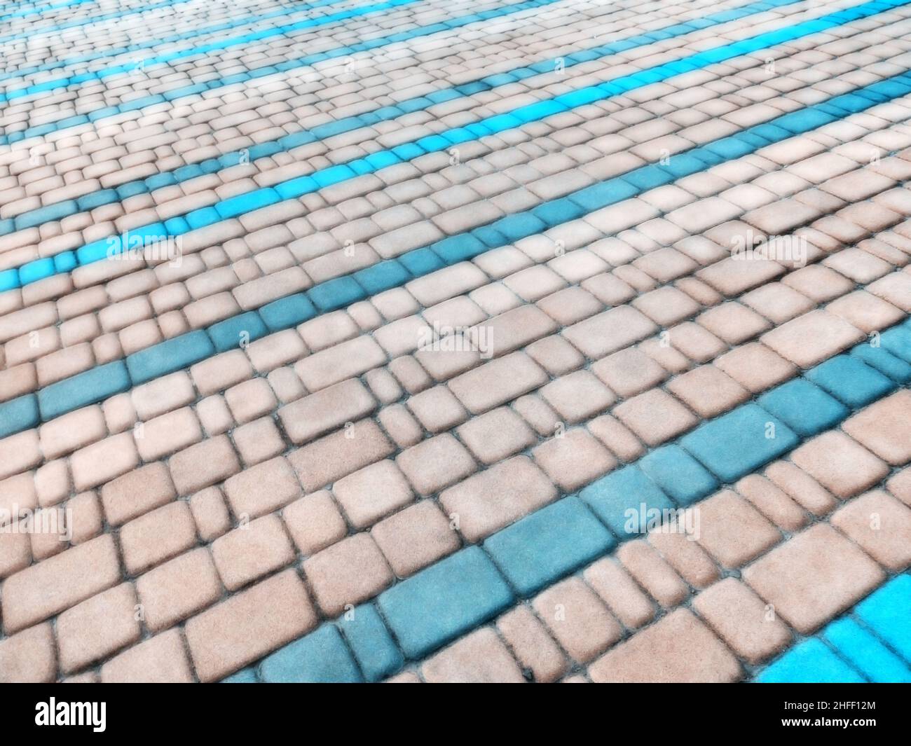 Abstract blurred background decorative paving slabs viewed at a slight angle Stock Photo
