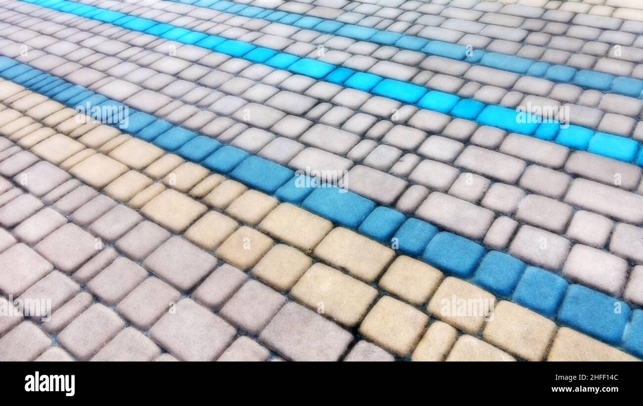 Abstract blurred background decorative paving slabs viewed at a slight angle Stock Photo