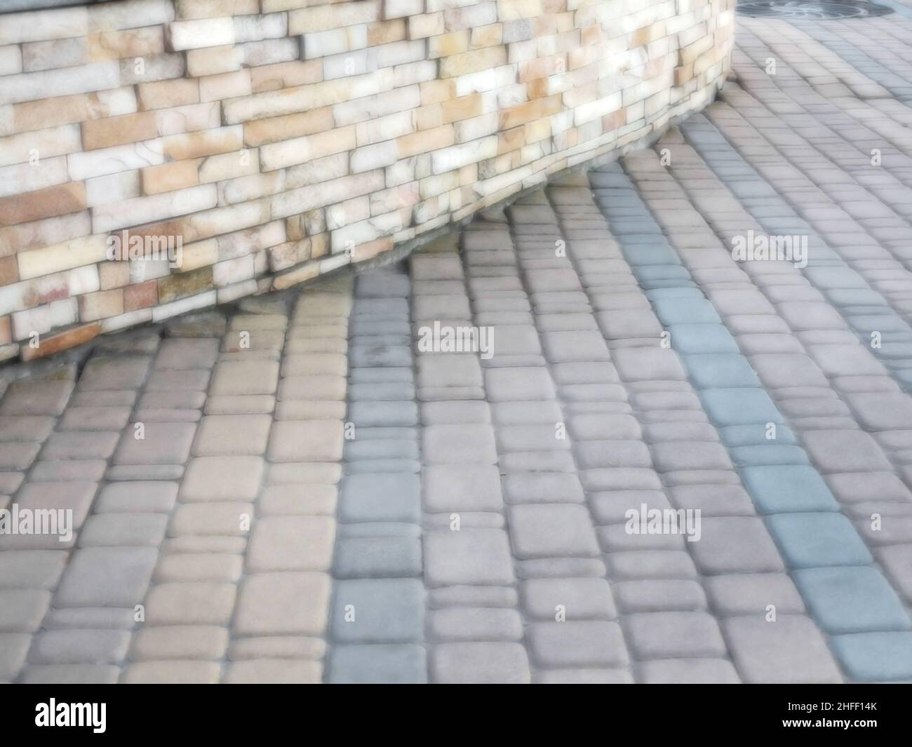 Abstract blurred background decorative paving slabs viewed at a slight angle Stock Photo