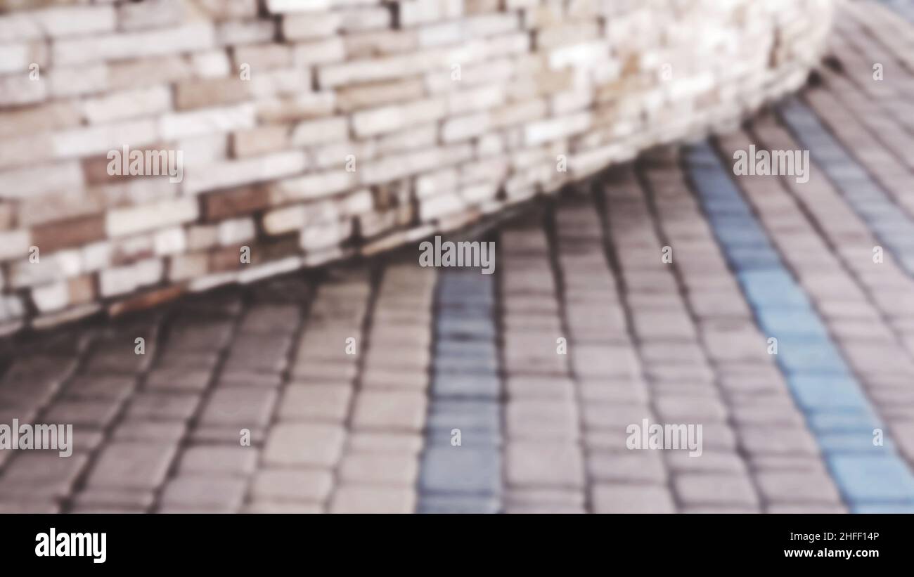 Abstract blurred background decorative paving slabs viewed at a slight angle Stock Photo