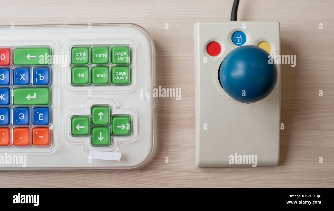 Closeup of a specialized computer mouse and keyboard for people with