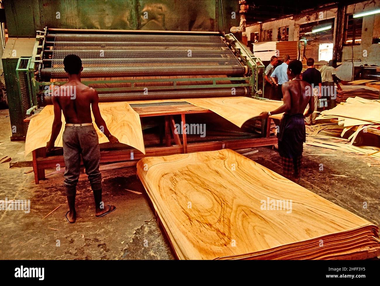 Veneer slicing machine in a sawmill in Ghana, West-Afric. Stock Photo