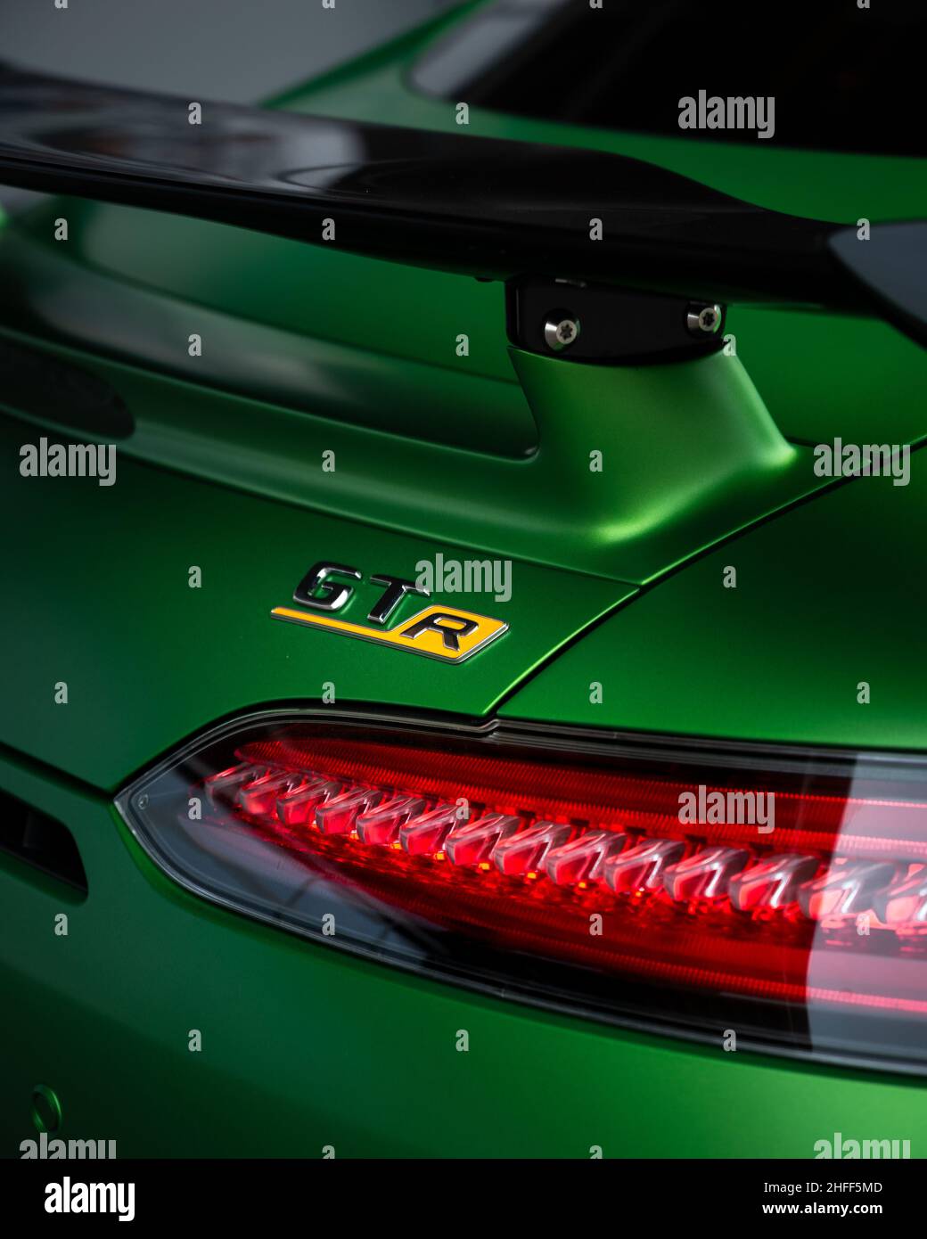 green Mercedes AMG GTR detail, car detail shot, rear spoiler Stock Photo