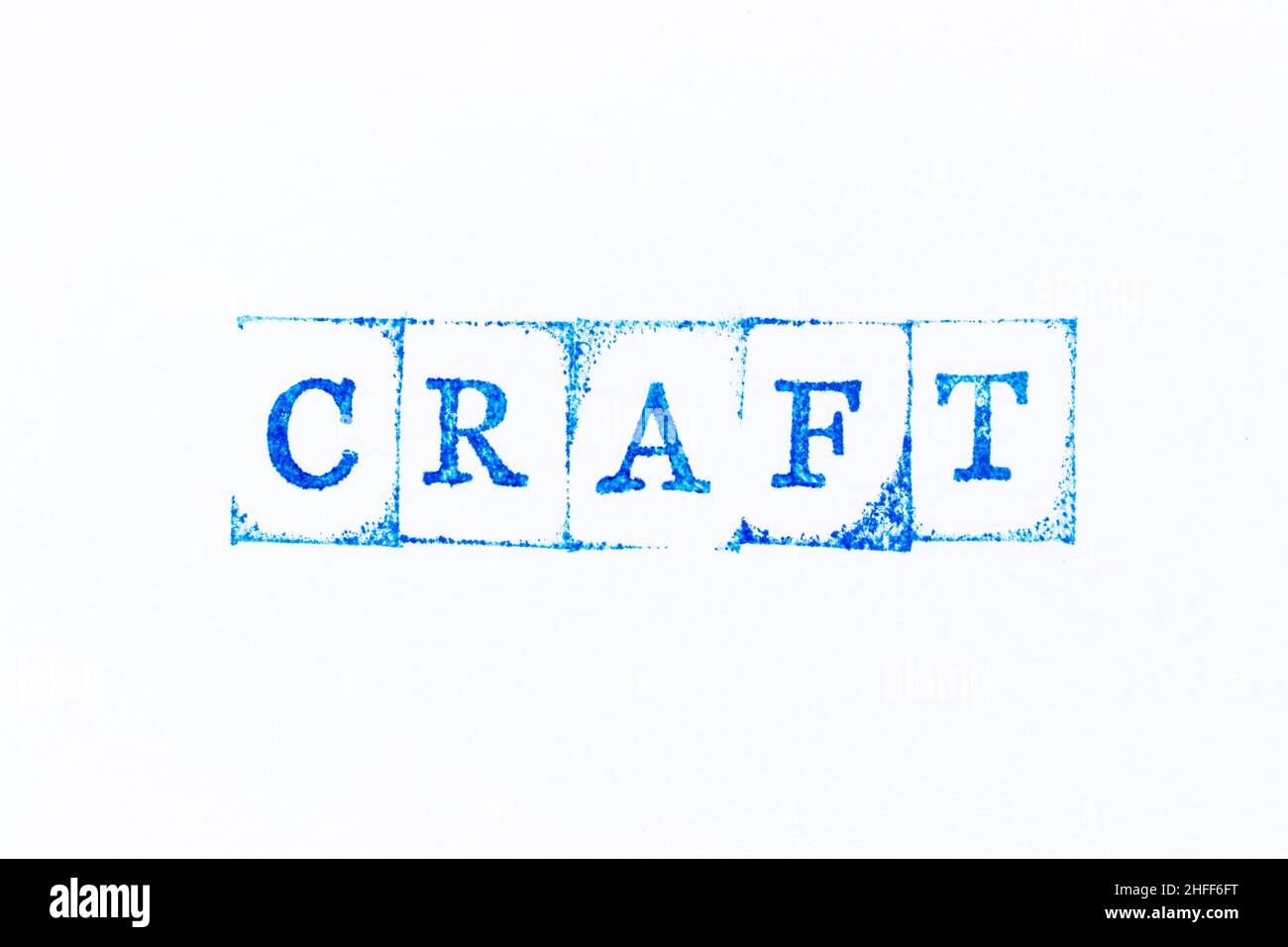 Blue color ink rubber stamp in word craft on white paper background ...