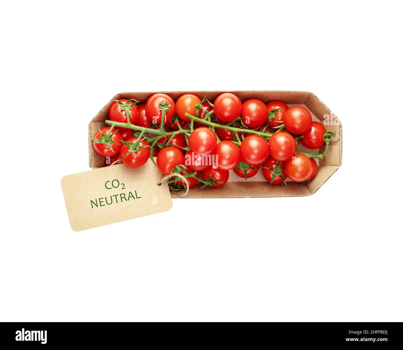 Isolated organic cherry tomatoes in an eco friendly craft package with a label with the inscription carbon neutral on a white background. Season locka Stock Photo