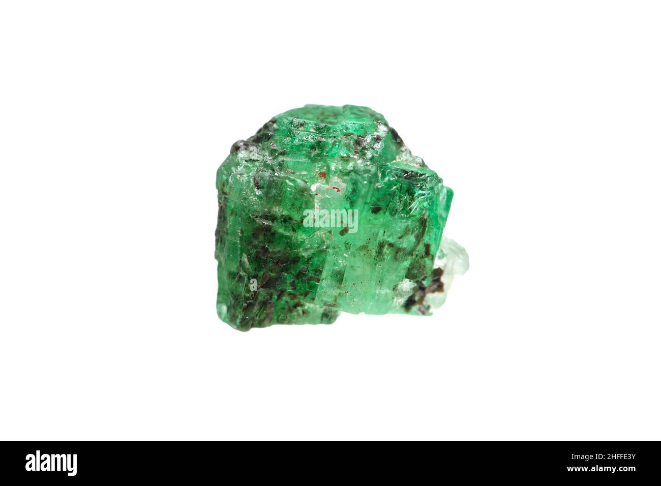 Closeup natural rough emerald (green beryl) crystal with mica inclusion Stock Photo