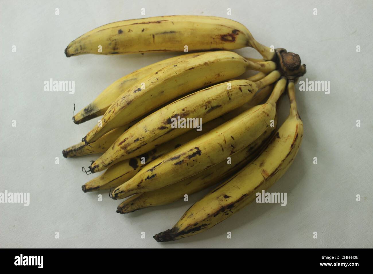 Ripe plantain yellow in colour and thin round plantain slices, ready to eat. Ethakka or plantain is a major banana variety called genus musa that are Stock Photo