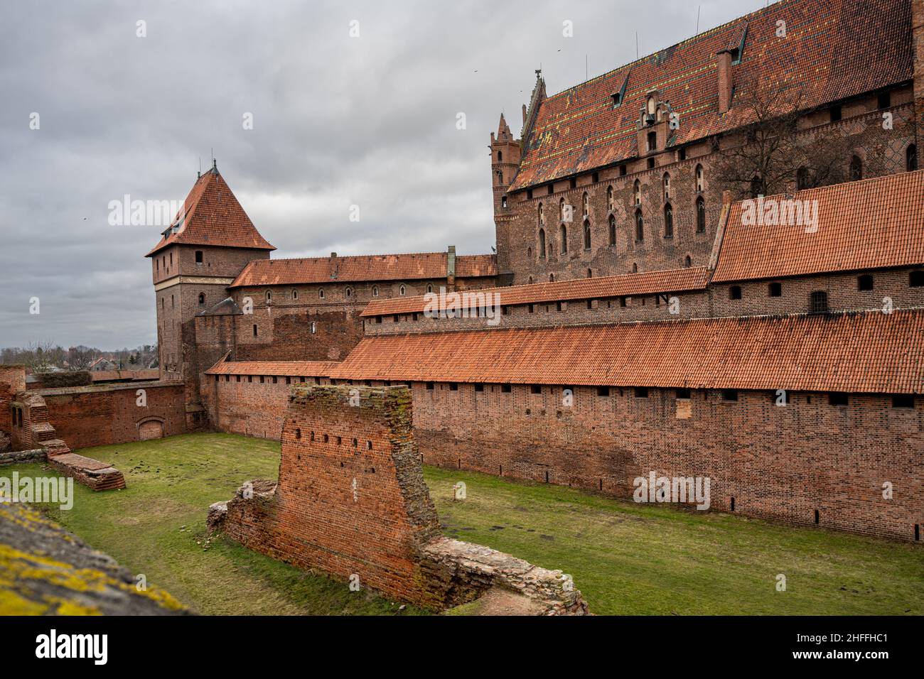 The medieval Castle of the Teutonic Order in Malbork in the Pomerania region, Poland. This is the largest castle in the world measured by land area and a UNESCO World Heritage Site Stock Photo