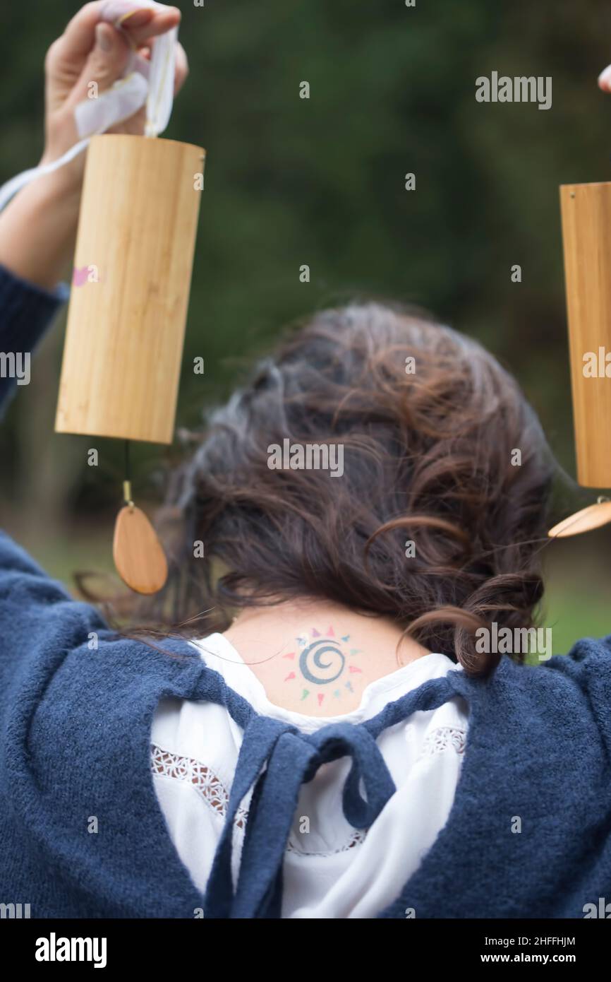 Girl holding Tibetan bells outdoors, sound therapy Stock Photo Alamy
