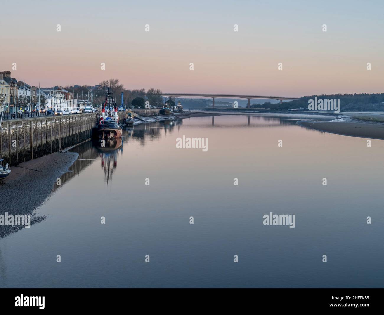 Winter dawn in Bideford, North Devon, England. Old boats and the New Bridge. Stock Photo