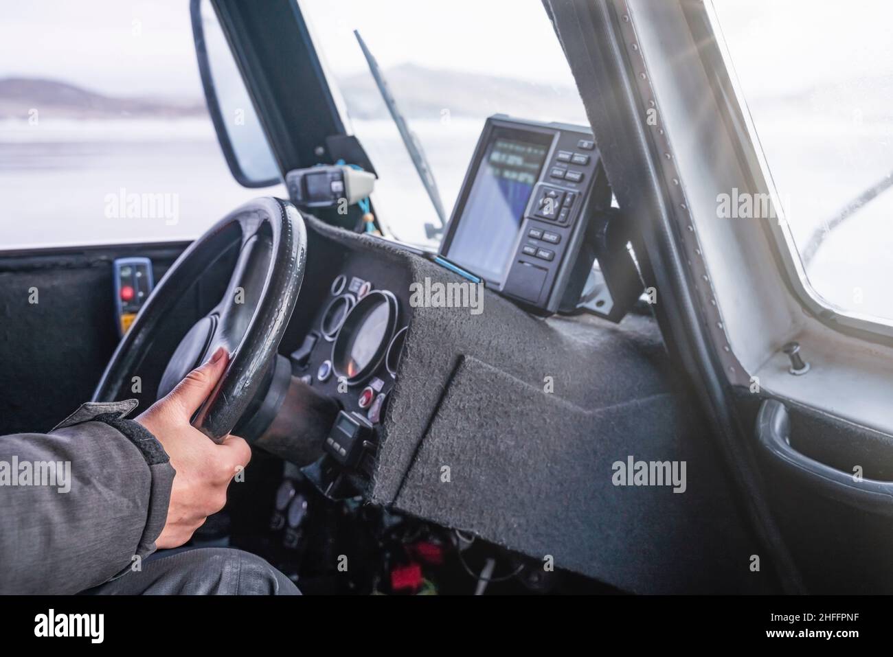 Closeup Hand of driver holding steering wheel while driving a