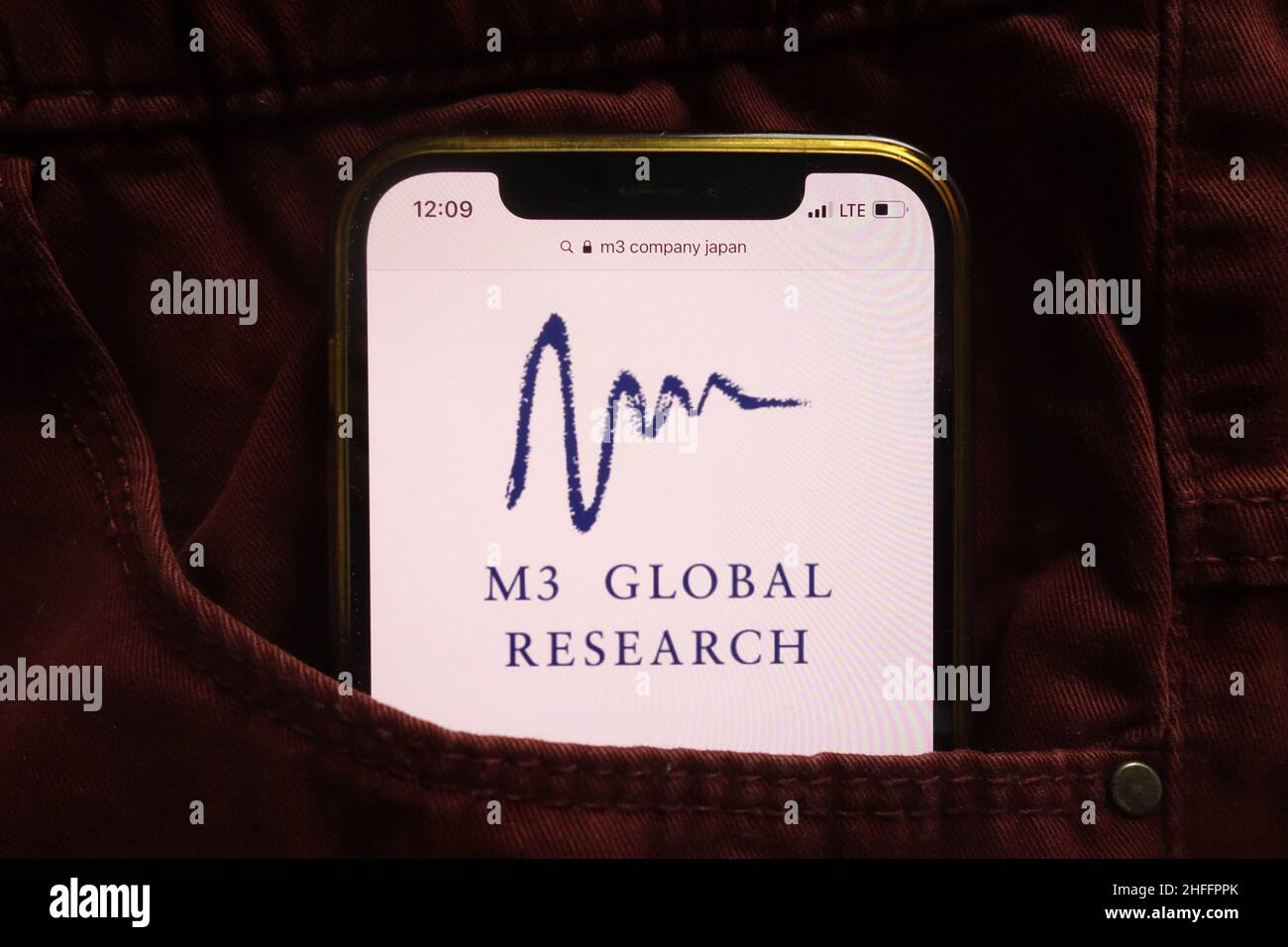 KONSKIE, POLAND January 15, 2022 M3 Global Research logo displayed on mobile phone hidden in