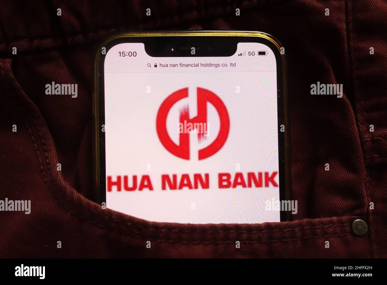 KONSKIE, POLAND - January 15, 2022: Hua Nan Bank logo displayed on mobile phone hidden in jeans pocket Stock Photo