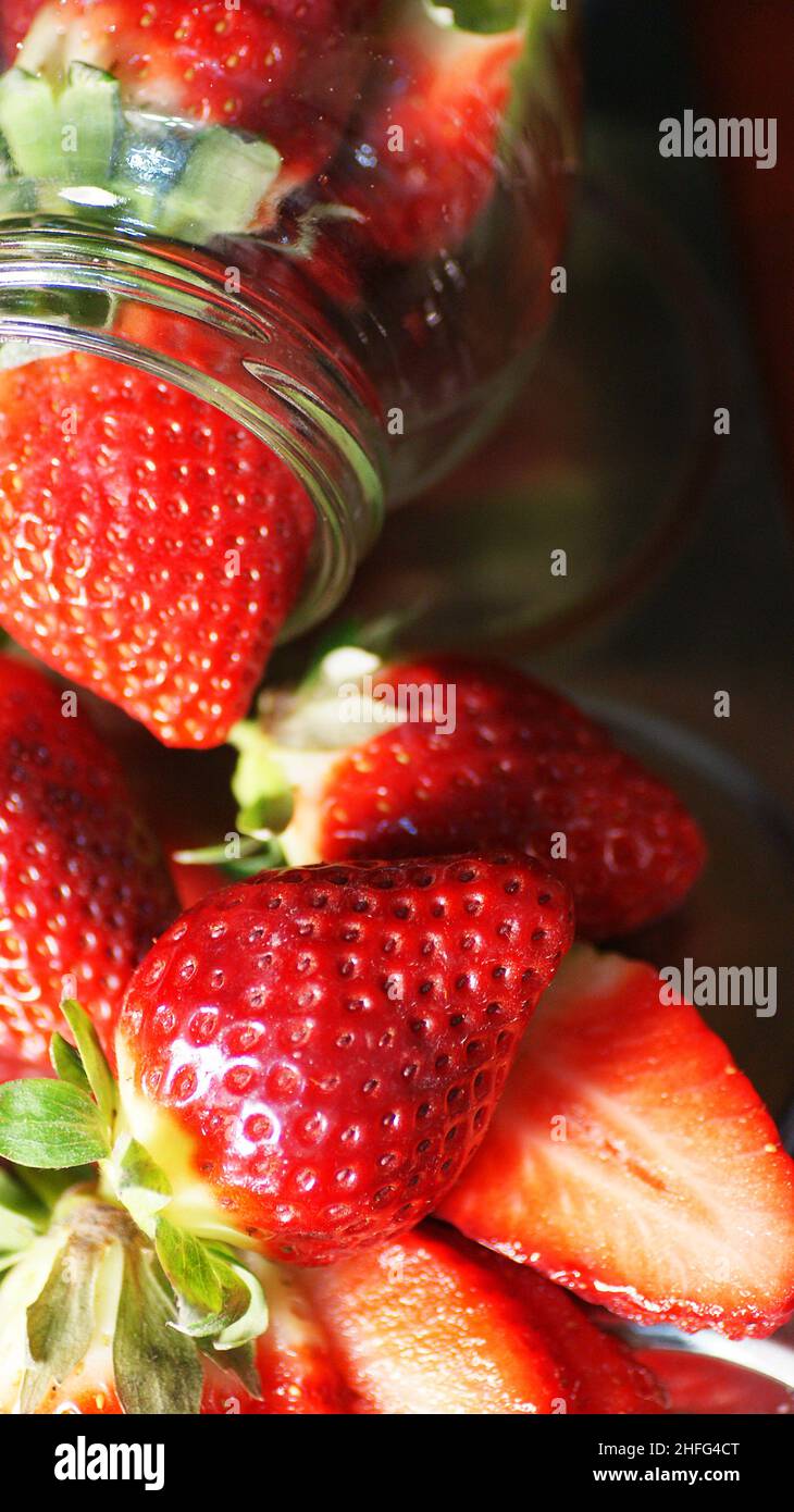 Strawberries in glass jar on white background Stock Photo Alamy