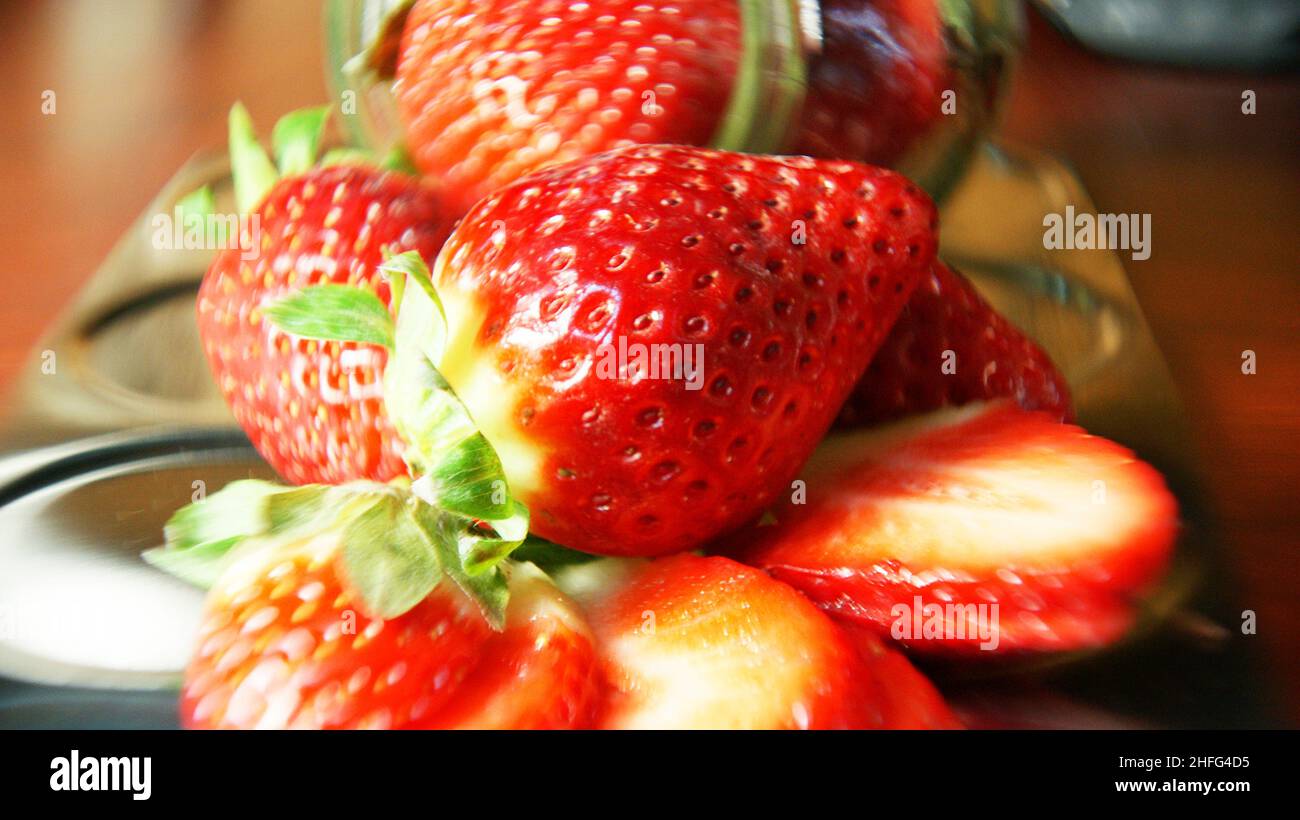 Strawberries in glass jar on white background Stock Photo Alamy