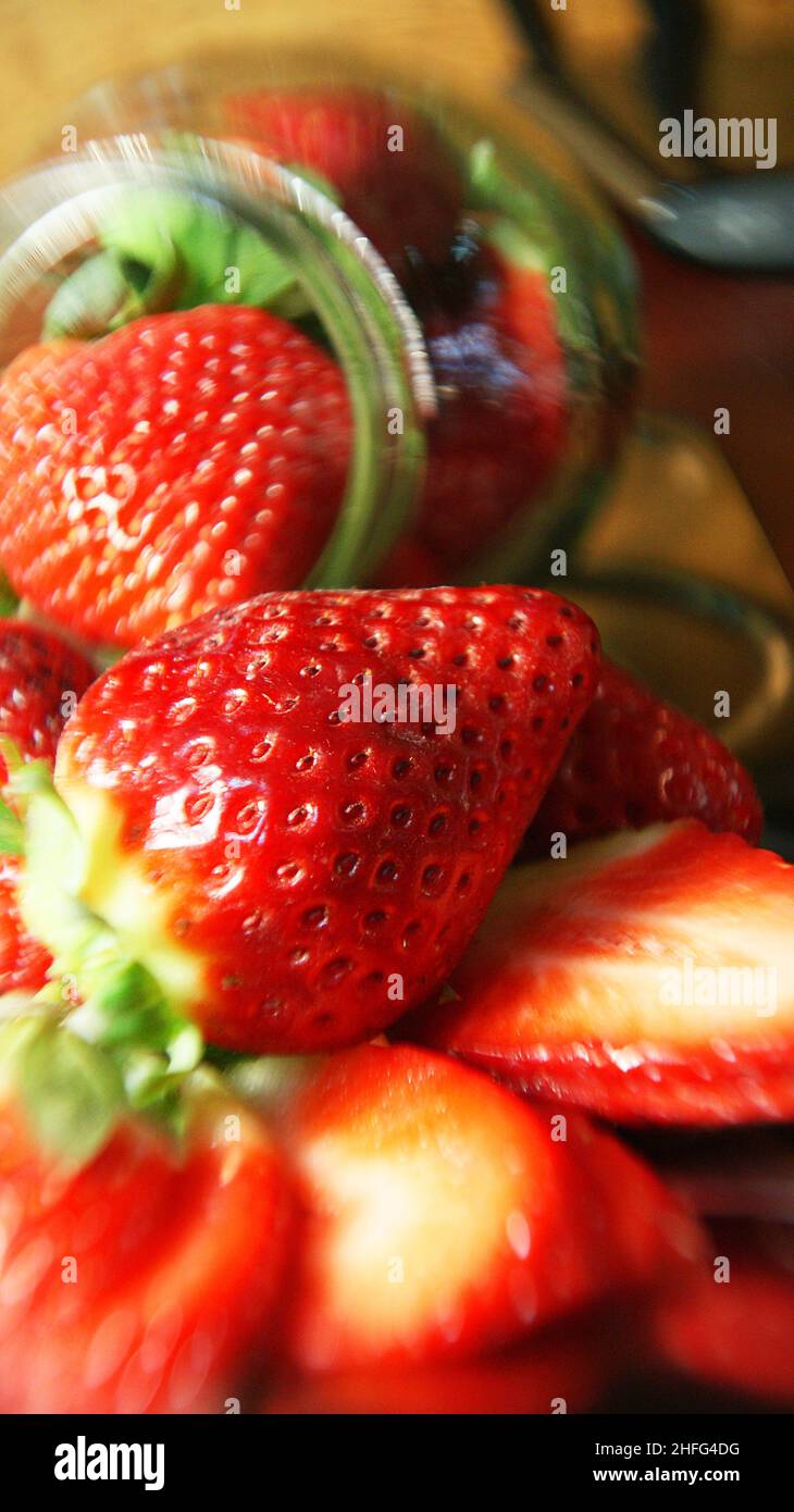Strawberries in glass jar on white background Stock Photo Alamy