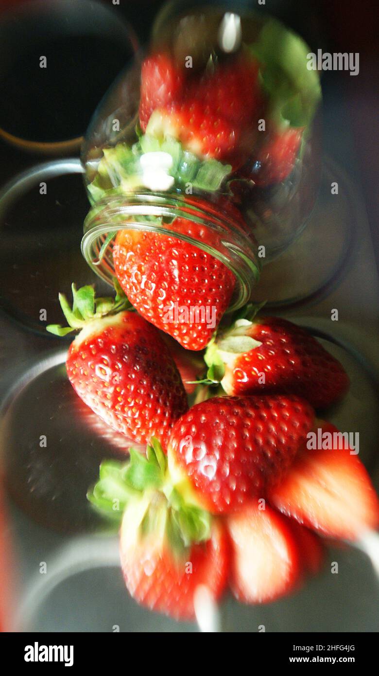 Strawberries in glass jar on white background Stock Photo Alamy