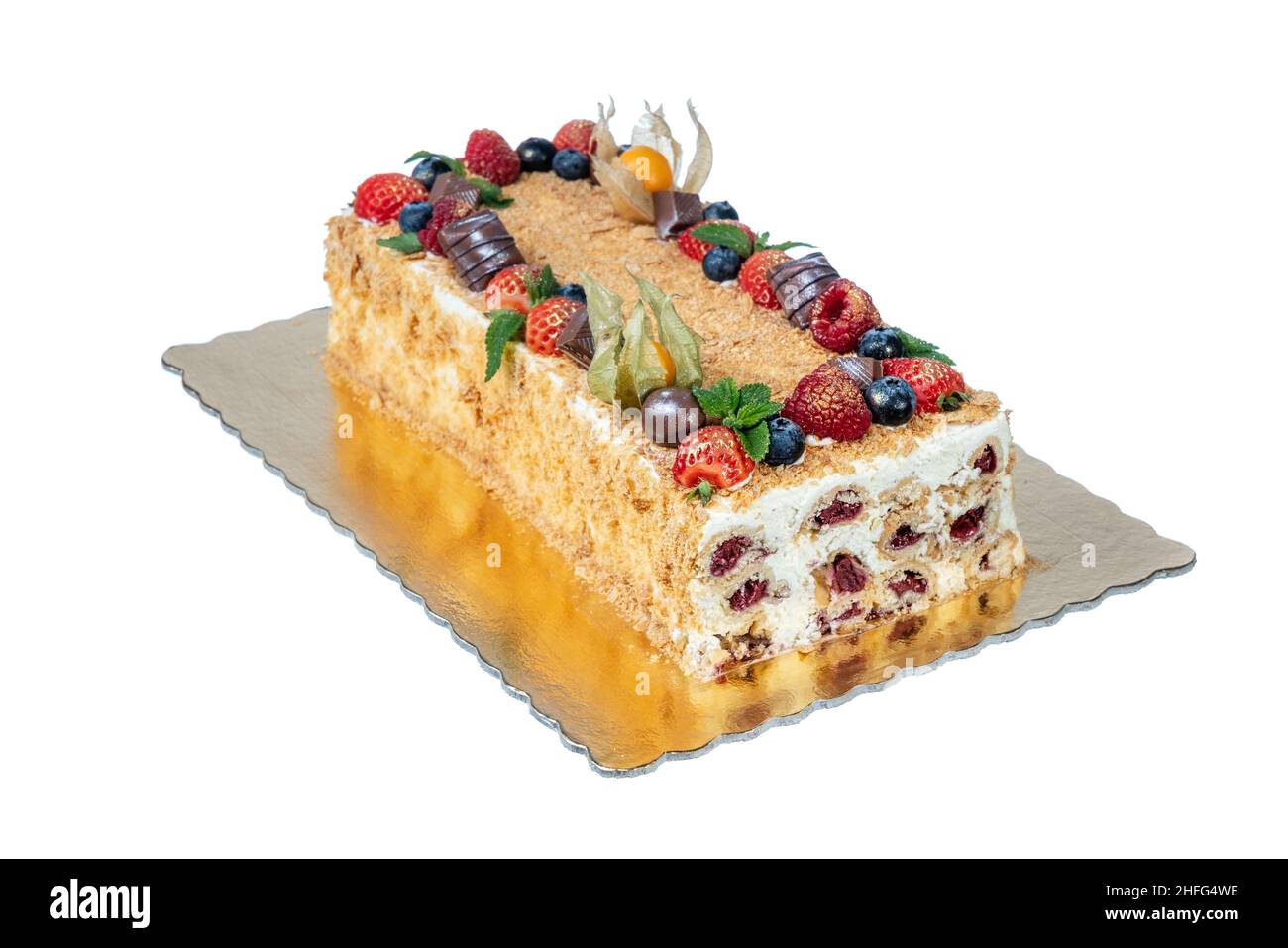 Festive New Year and Christmas cake with monastic cherries in the form of a hut. on a white background. Stock Photo