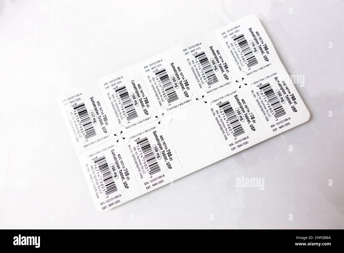 Seattle, WA USA - circa December 2021: Selective focus view of a blister pack of sumatriptan migraine medication on a white background. Stock Photo