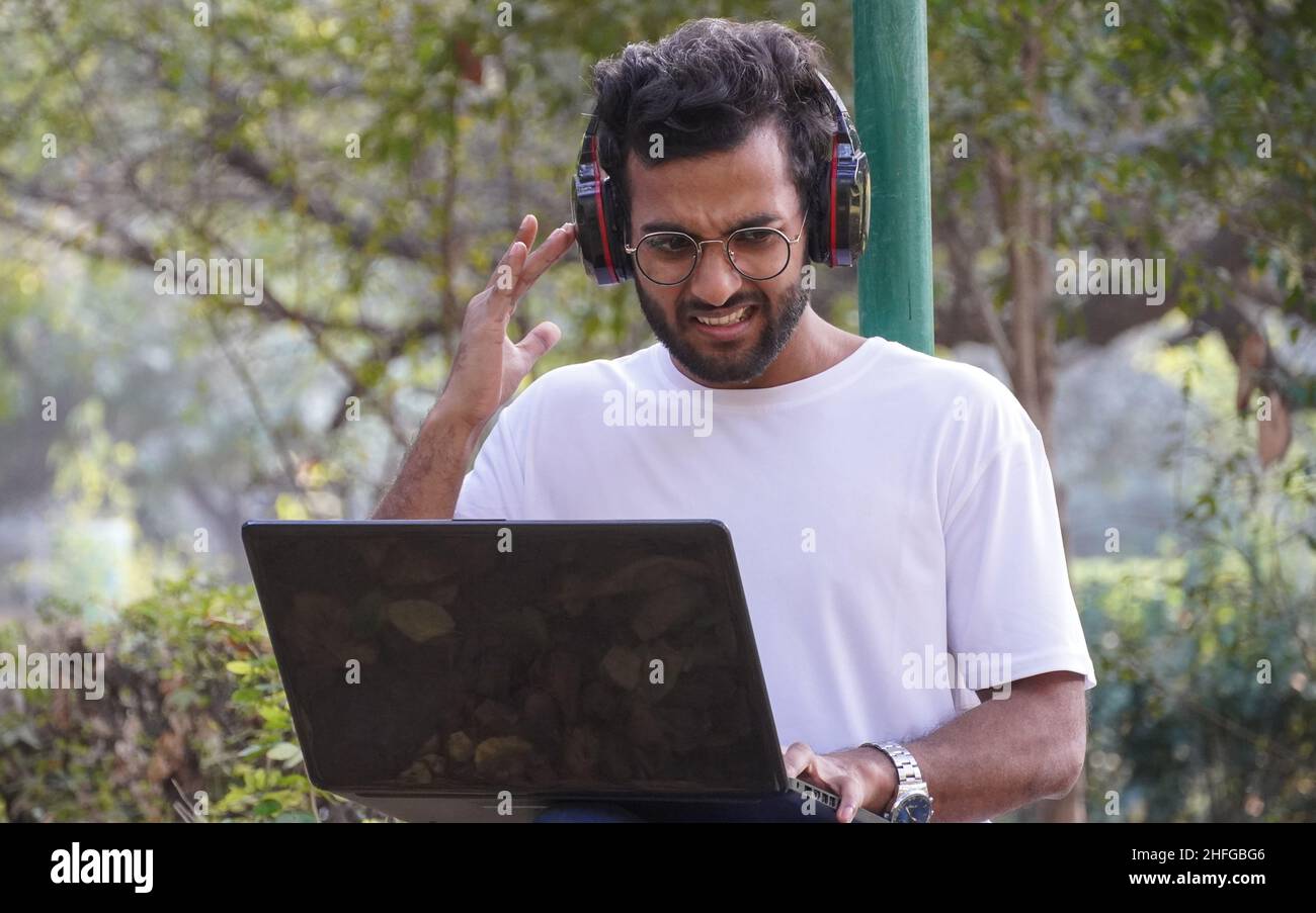 Young Student with laptop network problem during video call man with