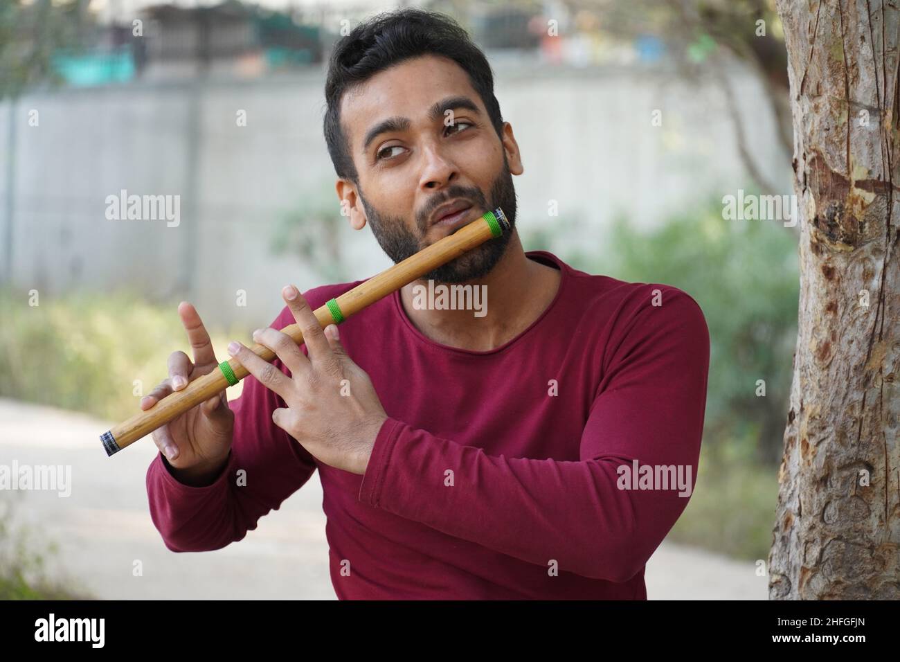 A man is playing the musical instrument Stock Photo