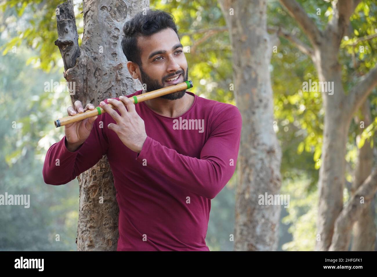 Man Playing Flute - Indian Musical Instrument Stock Photo