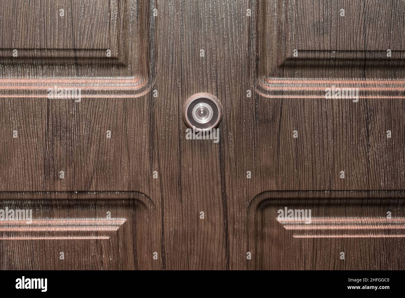 Peephole door eye look hole from spy security, safety closeup Stock