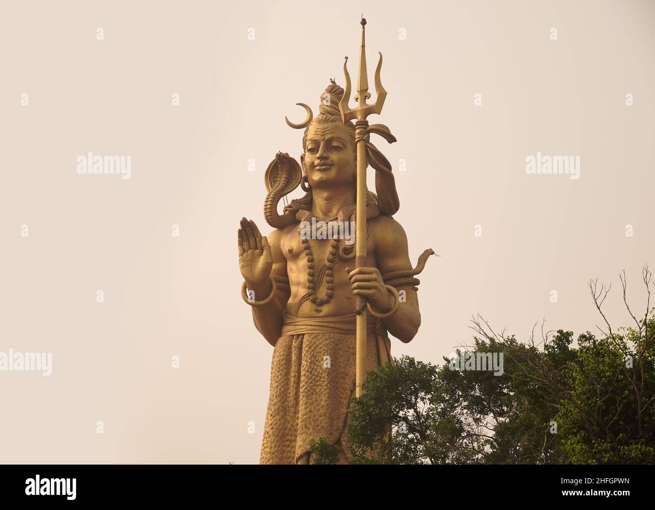 hindu god shiva statue with beautiful landscape - God Shiva Image Stock Photo