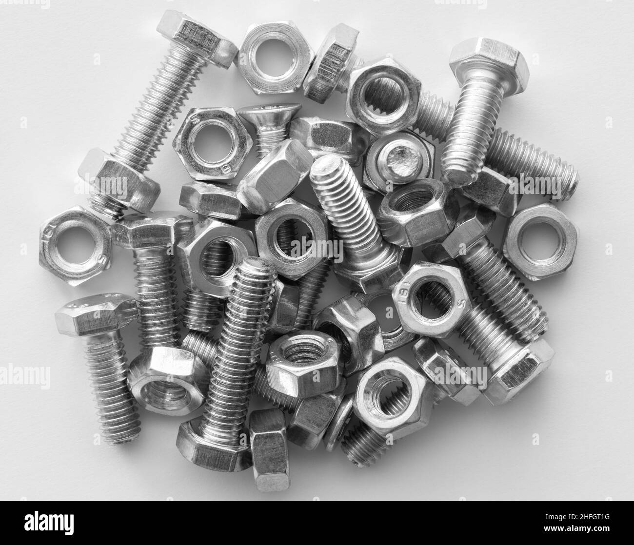 Metal nuts and bolts Isolated on white background Stock Photo - Alamy