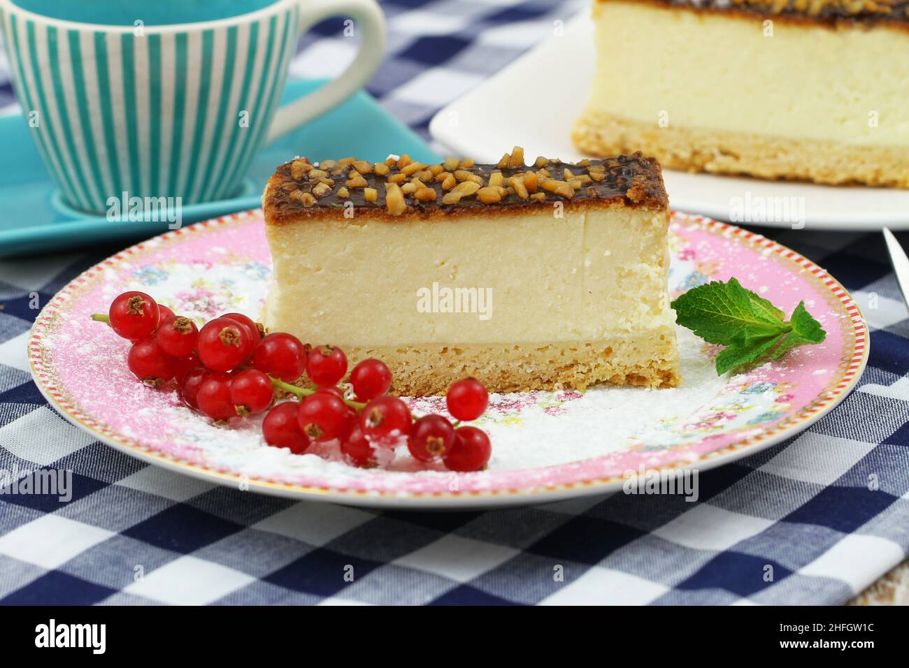 Traditional baked cheesecake with chocolate topping and nuts Stock Photo