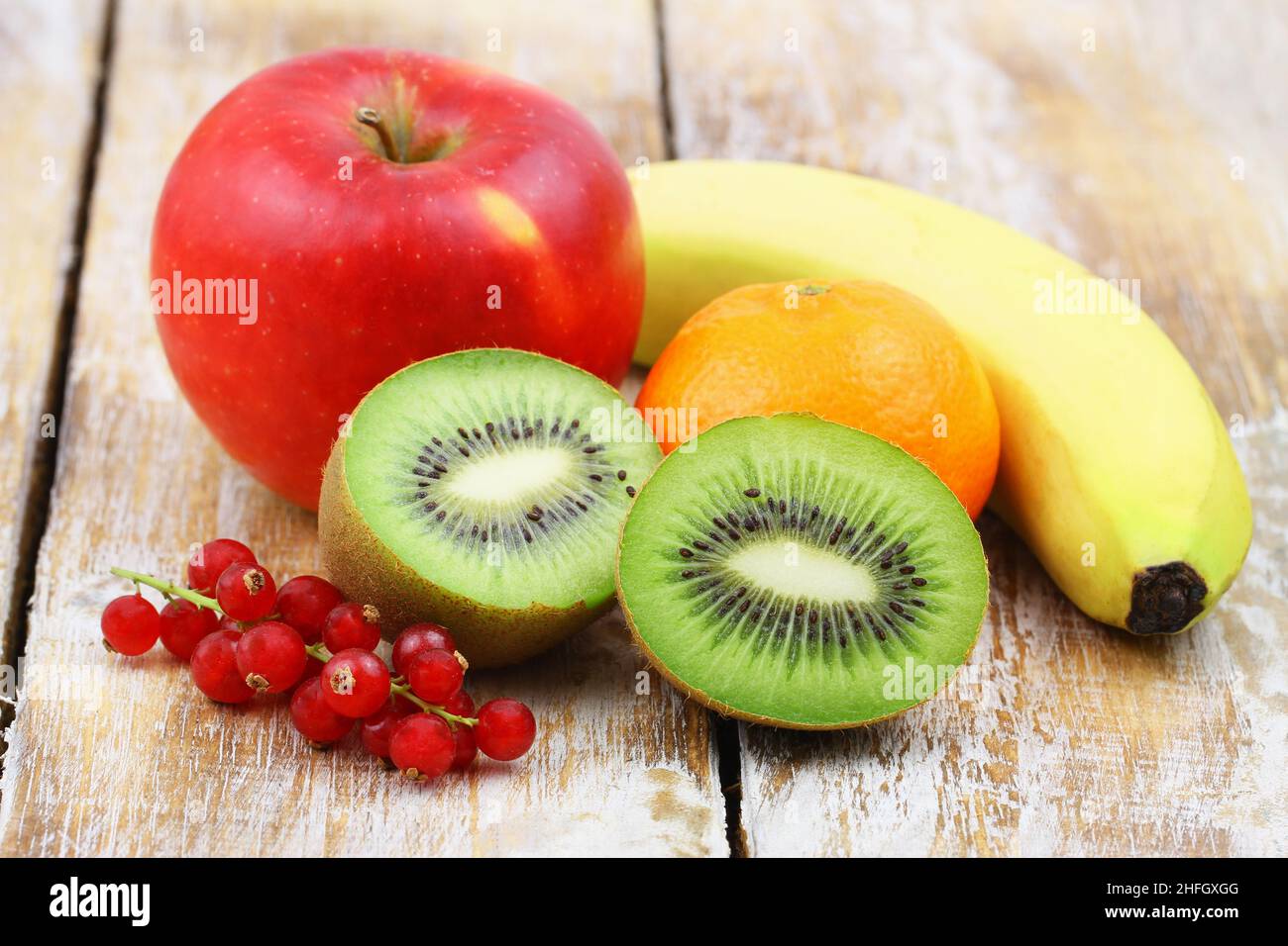 Fresh fruit: kiwi, apple, mandarine, banana and red current - best source of vitamin C Stock Photo