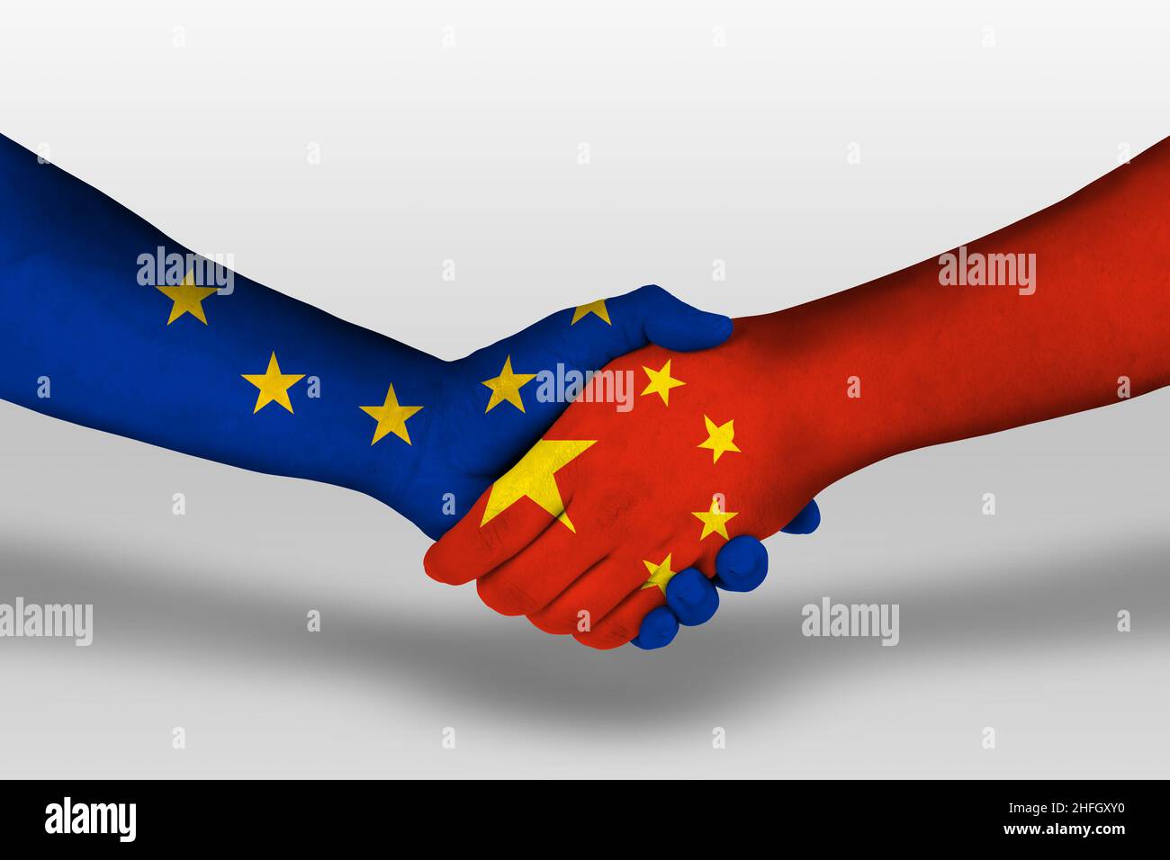 Handshake between canada and european union flags painted on hands, illustration with clipping path. Stock Photo