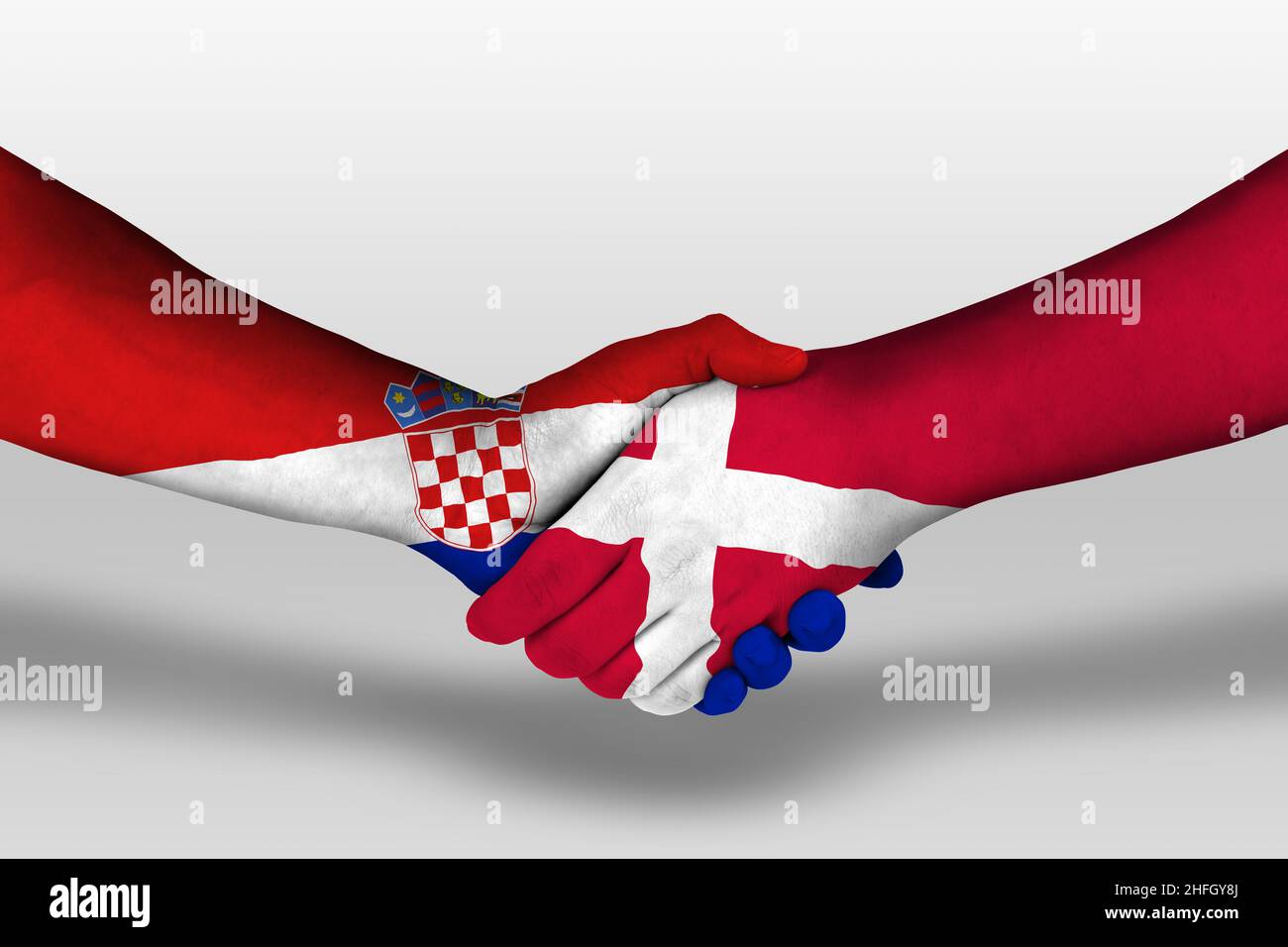 Handshake between cuba and croatia flags painted on hands, illustration with clipping path. Stock Photo