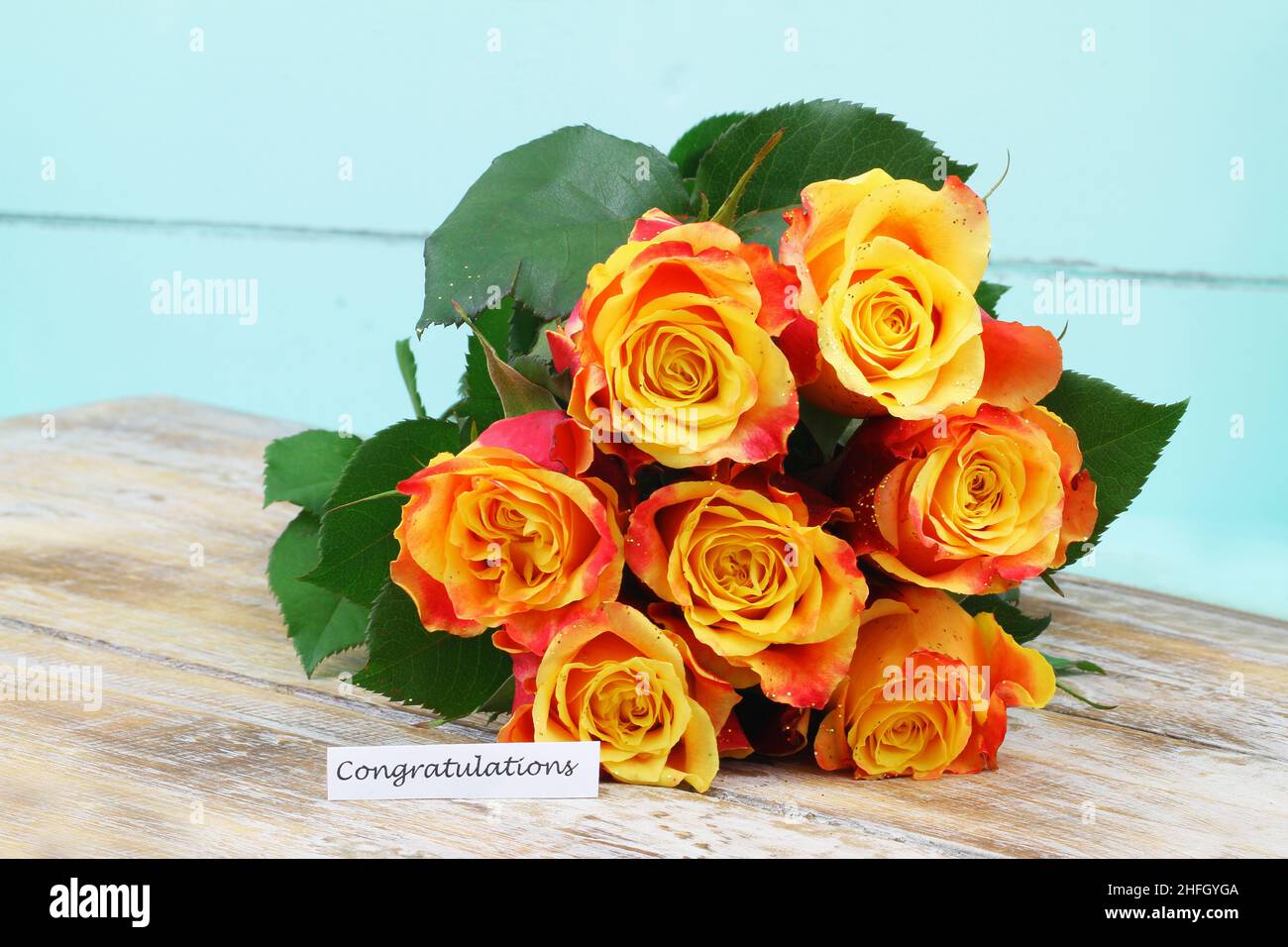 Congratulations card with colorful bouquet of roses sprinkled with glitter Stock Photo