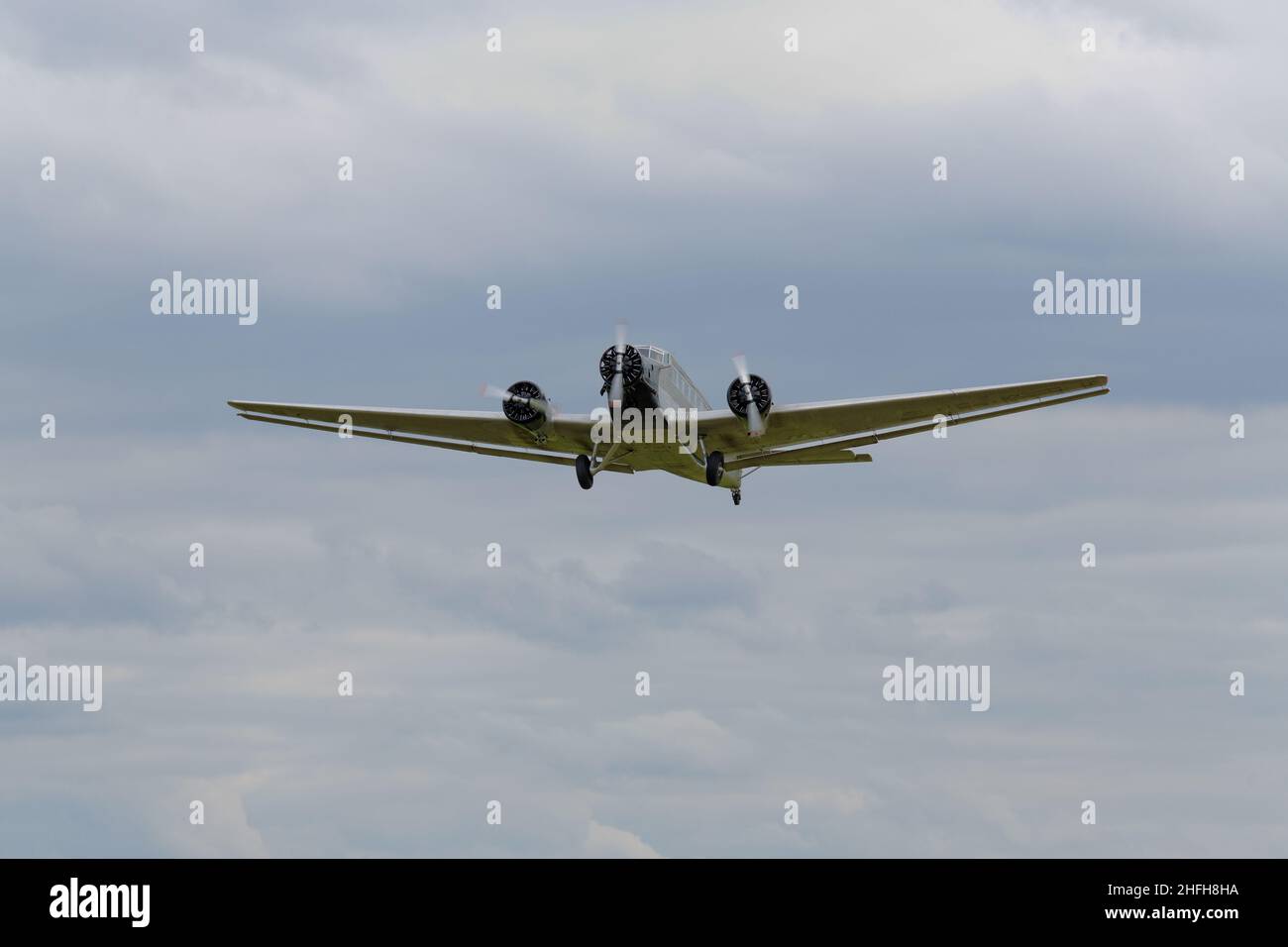 an old three-engine airliner in flight, the Ju 52 Stock Photo