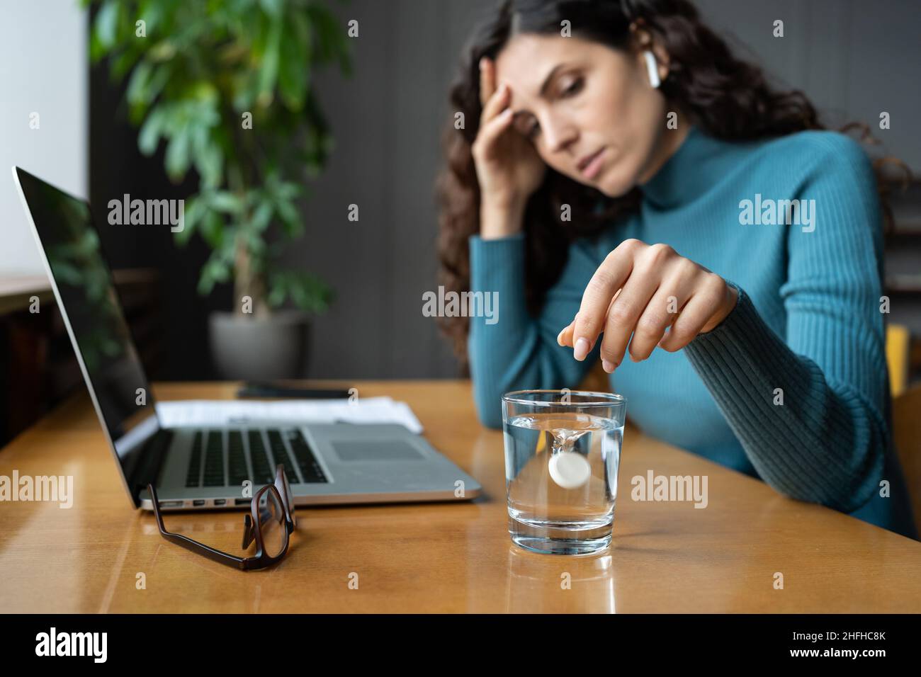 Unhealthy woman suffer from headache migraine in office dissolving